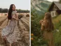 Deux jeunes femmes dans un champ de blé et près d'une cabane, style cottagecore. L'une tient un bouquet de fleurs sauvages, l'autre des fruits.