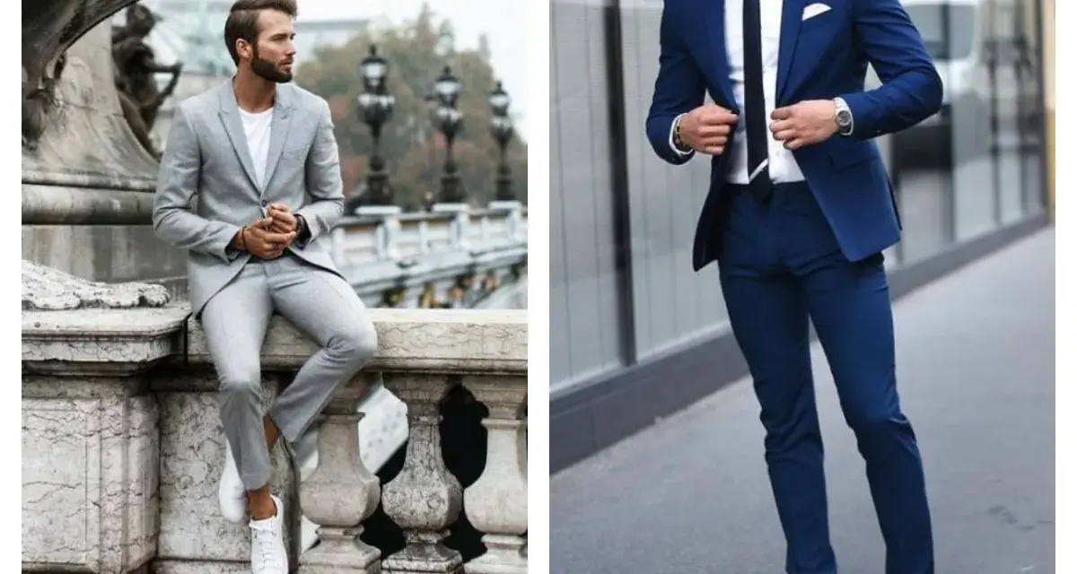 Un homme en costume bleu marine et baskets blanches, prêt pour une journée élégante mais décontractée.