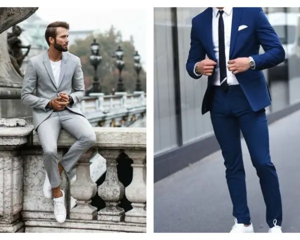 Un homme en costume bleu marine et baskets blanches, prêt pour une journée élégante mais décontractée.