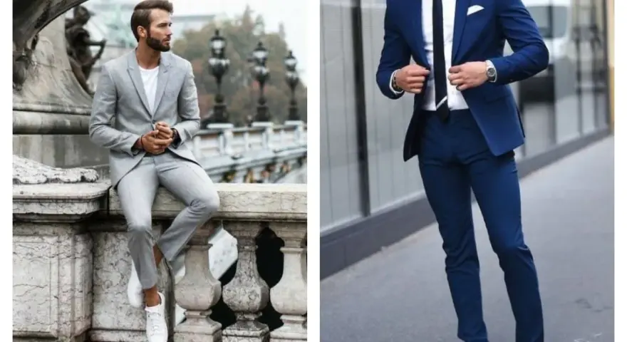Un homme en costume bleu marine et baskets blanches, prêt pour une journée élégante mais décontractée.
